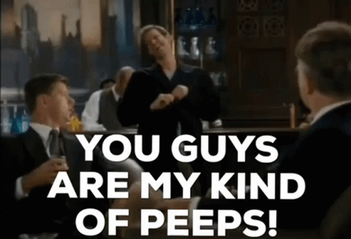 a-group-of-men-are-sitting-at-a-bar-talking-to-each-other-and-one-man-is-dancing